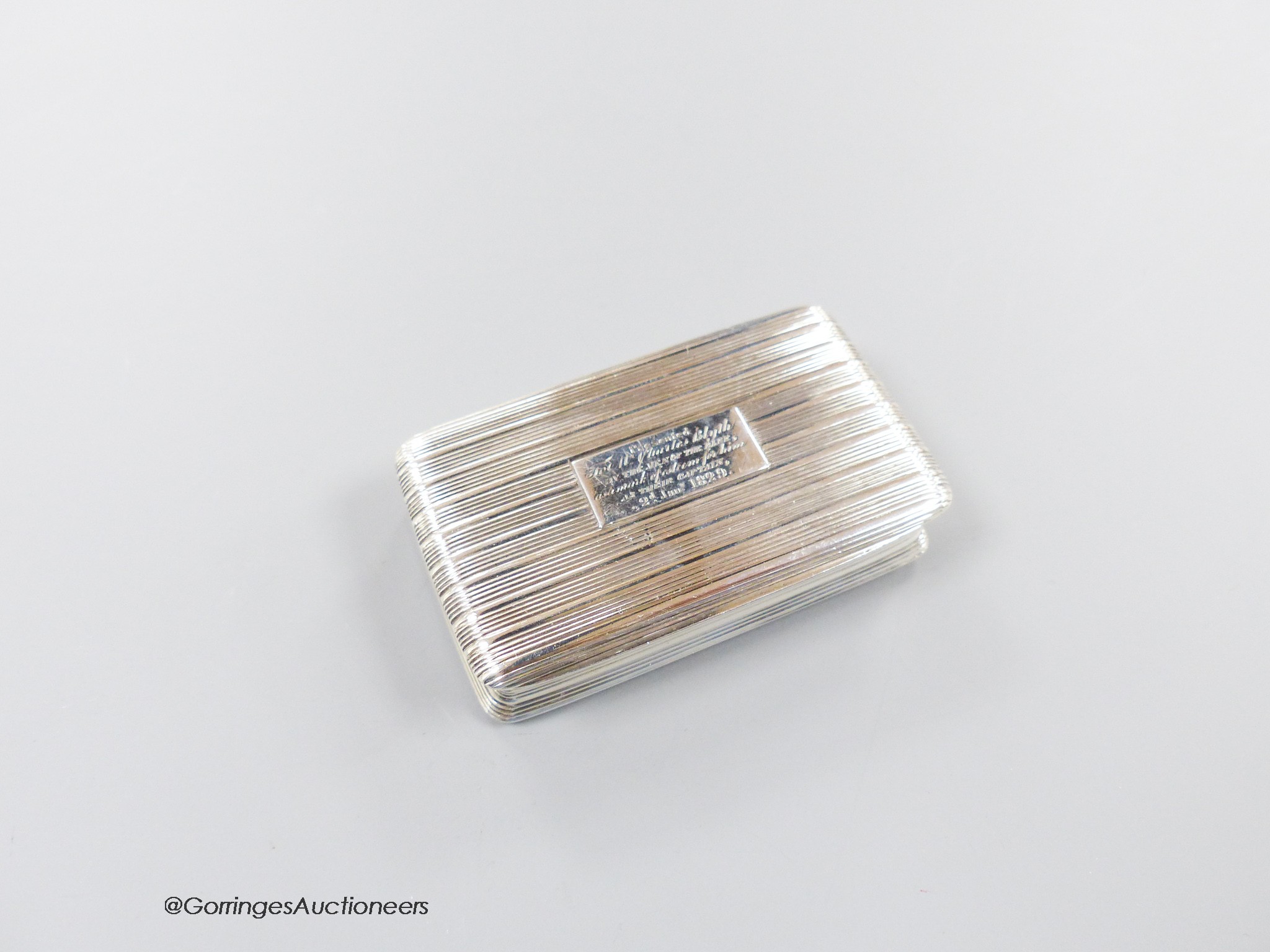 A George IV ribbed silver rectangular snuff box, with engraved inscription, Thomas Shaw, Birmingham, 1824, 71mm, 74 grams.